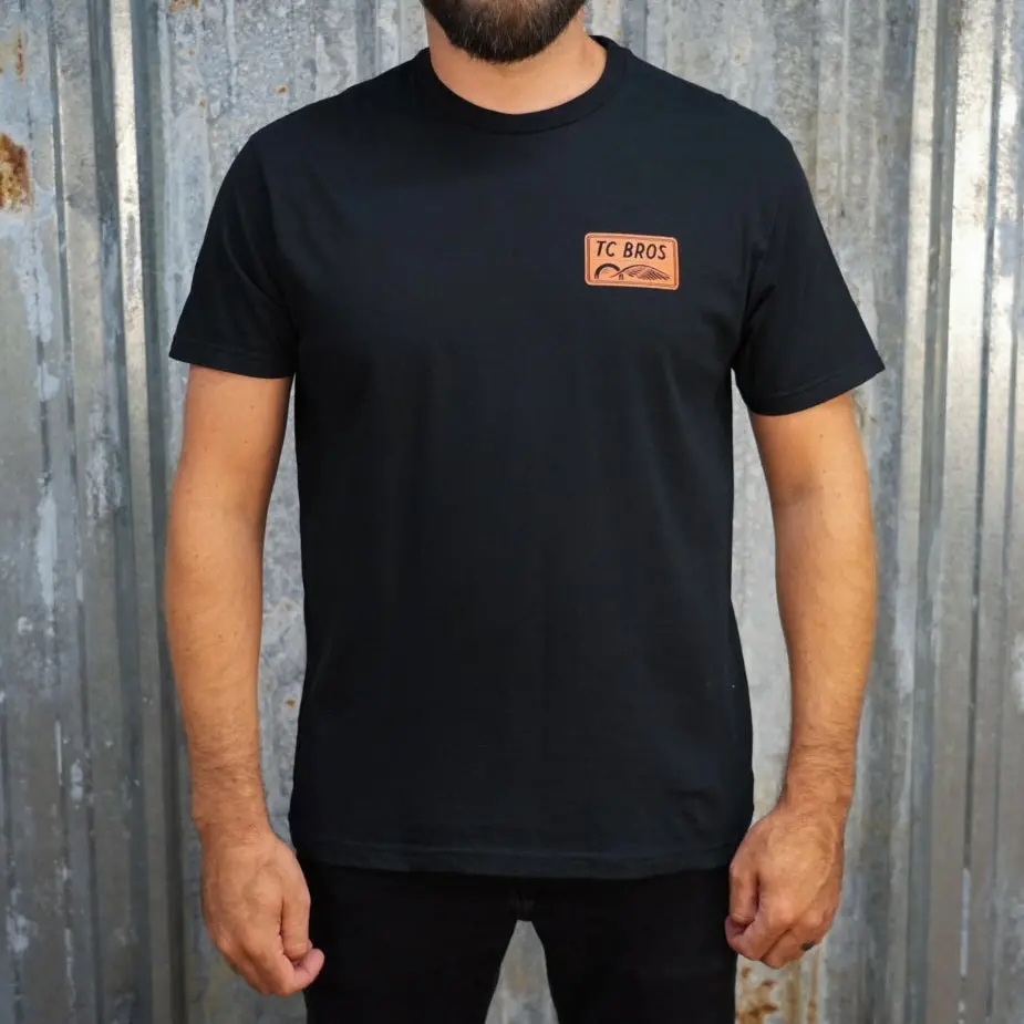 Badge - Black Tee 1